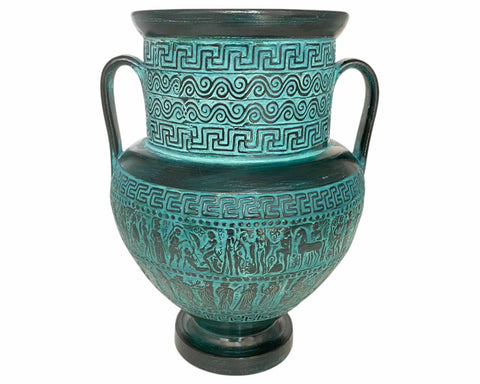 Decorative turquoise vase with intricate patterns on a white background